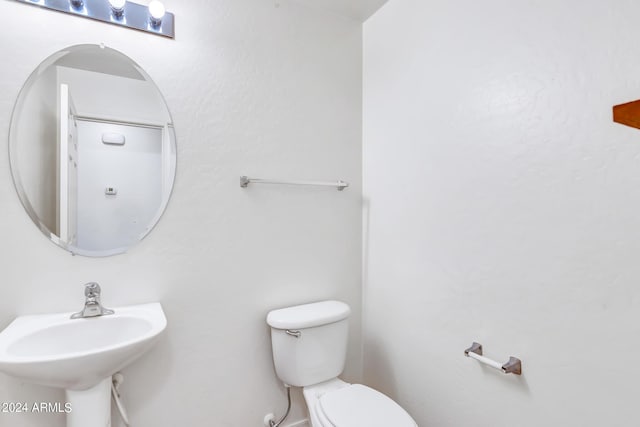 bathroom with toilet and sink