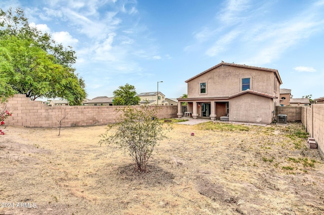 rear view of house featuring a patio