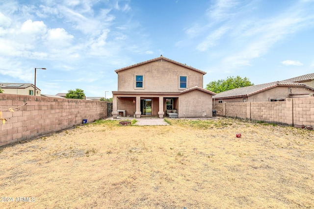 back of property featuring a patio