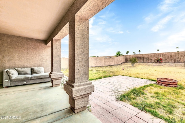 view of patio / terrace with an outdoor fire pit