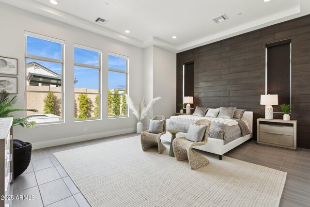 bedroom featuring light tile patterned flooring