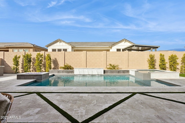 view of swimming pool featuring an in ground hot tub and a patio