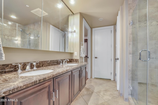 full bathroom with a stall shower and a sink