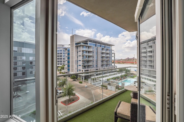 balcony with a city view and a water view
