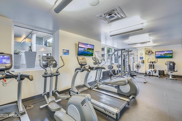 workout area featuring baseboards and visible vents
