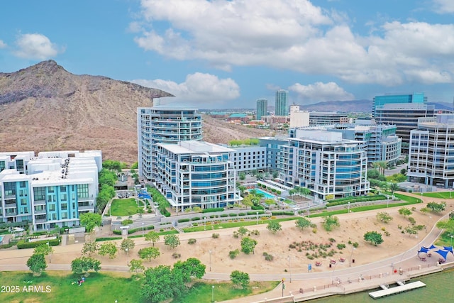 birds eye view of property featuring a view of city and a mountain view