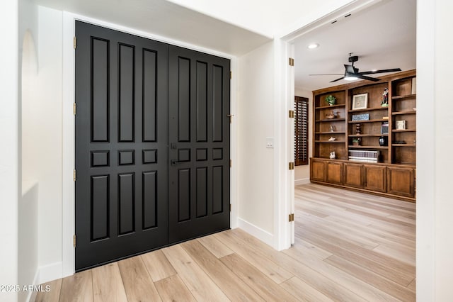 entrance foyer featuring ceiling fan and light hardwood / wood-style flooring