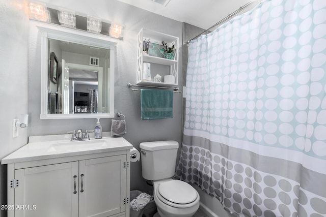 6701 W Catalina Dr, Phoenix, AZ 85033 - bathroom featuring toilet, curtained shower, and vanity