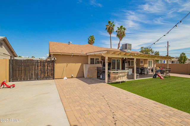 6701 W Catalina Dr, Phoenix, AZ 85033 - rear view of house featuring a patio area, fence, cooling unit, a yard, and stucco siding