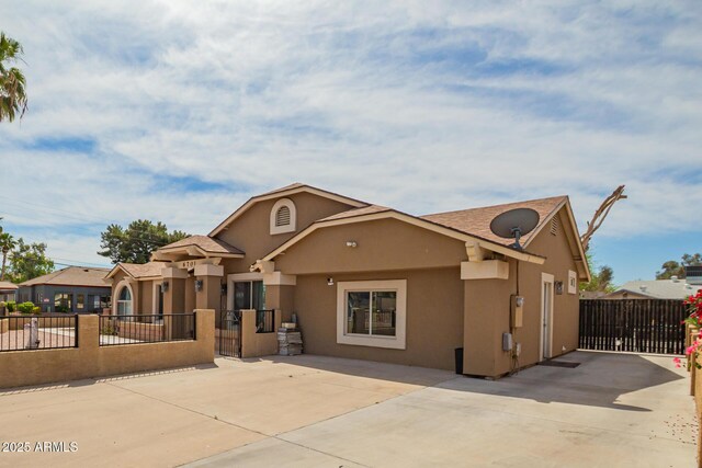 6701 W Catalina Dr, Phoenix, AZ 85033 - view of front of property featuring a gate, stucco siding, and fence private yard