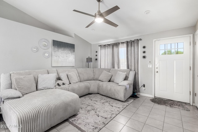 6701 W Catalina Dr, Phoenix, AZ 85033 - living area featuring baseboards, a ceiling fan, light tile patterned floors, and lofted ceiling