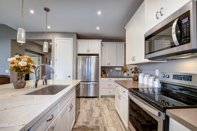 kitchen featuring sink, white cabinets, and stainless steel appliances