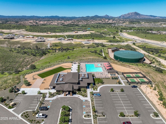 birds eye view of property featuring a mountain view