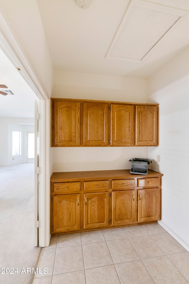 kitchen featuring ceiling fan and light tile patterned floors