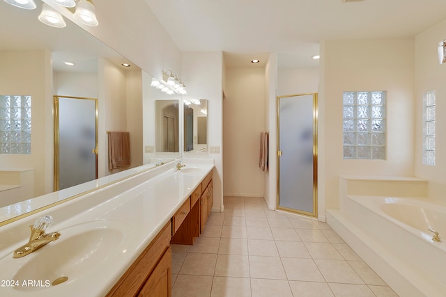 bathroom featuring vanity, separate shower and tub, and tile patterned floors