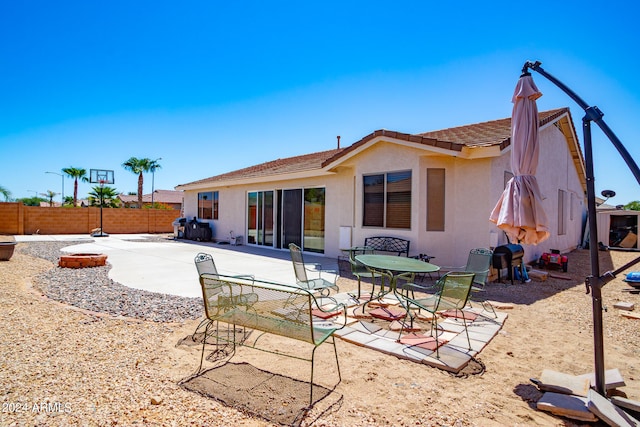 back of property featuring a patio area