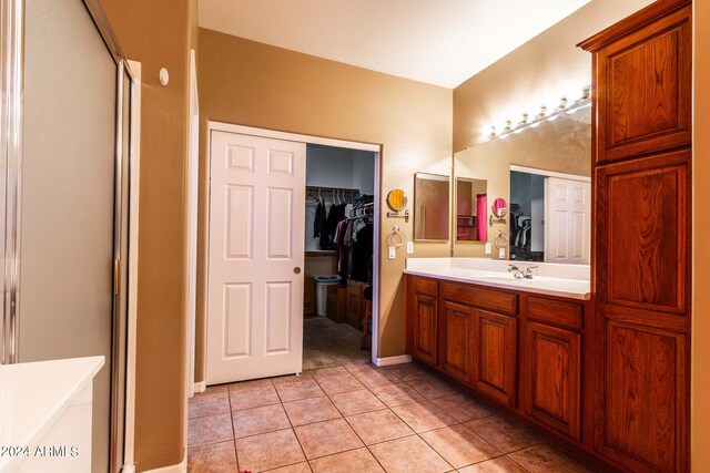 bathroom featuring separate shower and tub, tile patterned flooring, and vanity