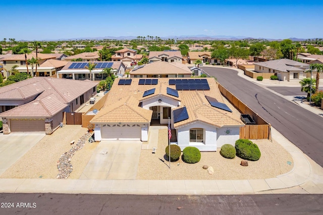 birds eye view of property with a residential view