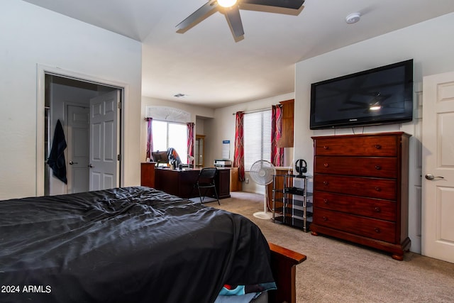 carpeted bedroom with a ceiling fan