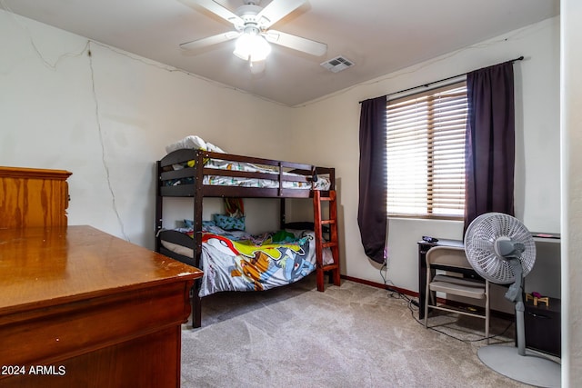 bedroom featuring baseboards, ceiling fan, visible vents, and carpet flooring