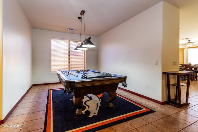 rec room with a healthy amount of sunlight, visible vents, and light tile patterned flooring