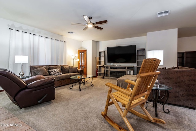 living room with a ceiling fan, carpet, and visible vents