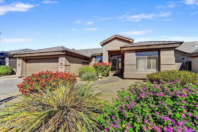 prairie-style home featuring a garage