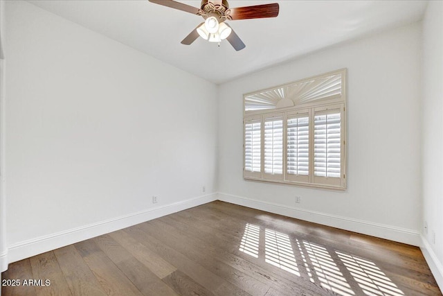 unfurnished room featuring ceiling fan and dark hardwood / wood-style floors