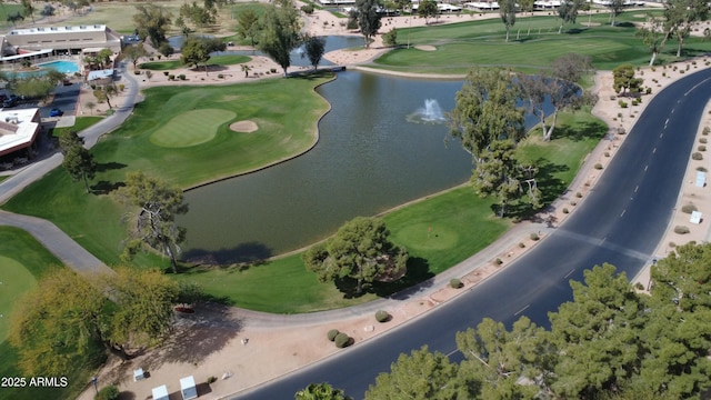 bird's eye view with a water view and golf course view