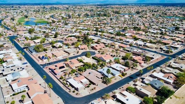 birds eye view of property with a water view and a residential view