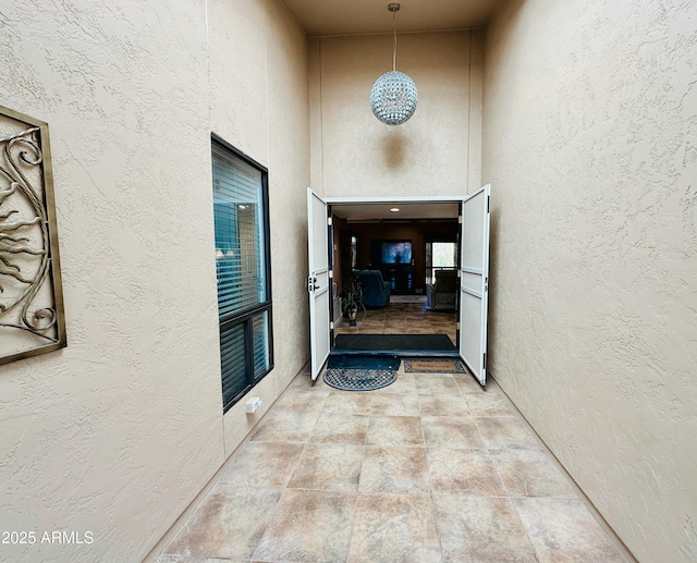 view of exterior entry with stucco siding