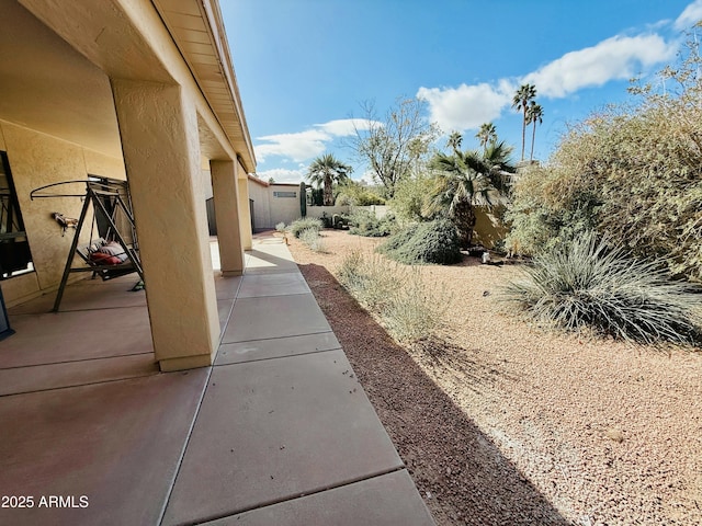 view of yard featuring a patio area and fence