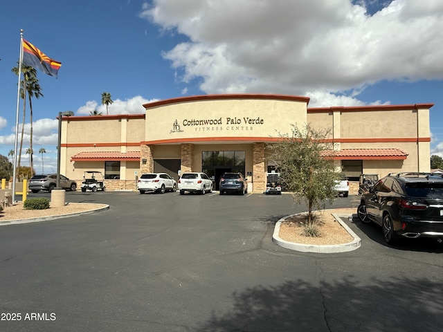 view of property featuring uncovered parking