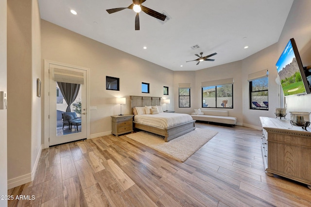 bedroom featuring ceiling fan and light hardwood / wood-style flooring