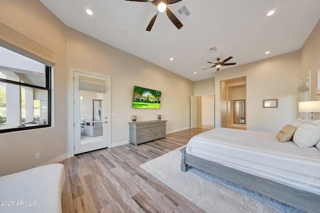 bedroom featuring access to outside, light wood-type flooring, and ceiling fan