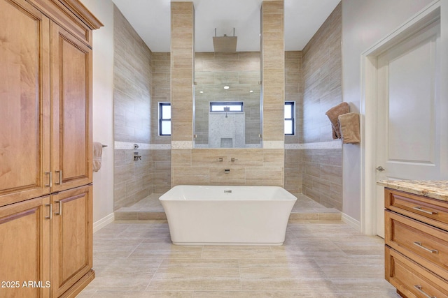 bathroom featuring tile walls, tile patterned flooring, separate shower and tub, and plenty of natural light