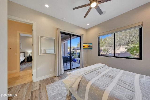 bedroom featuring ceiling fan, light hardwood / wood-style flooring, access to exterior, and multiple windows