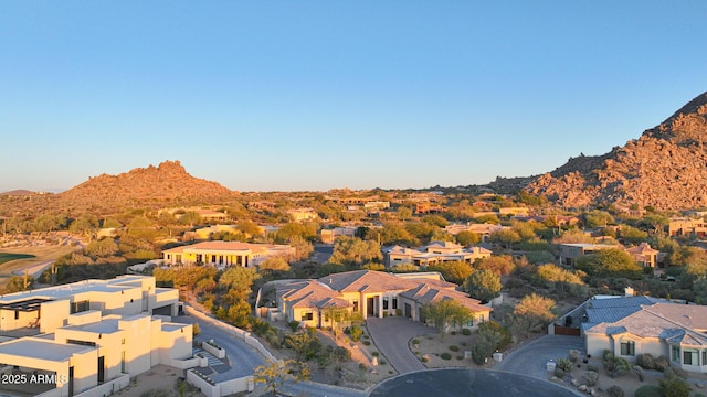 birds eye view of property with a mountain view