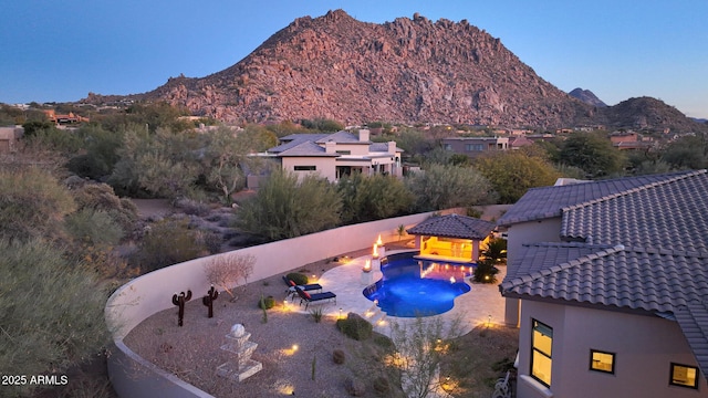 view of swimming pool featuring a gazebo, a patio area, and a mountain view