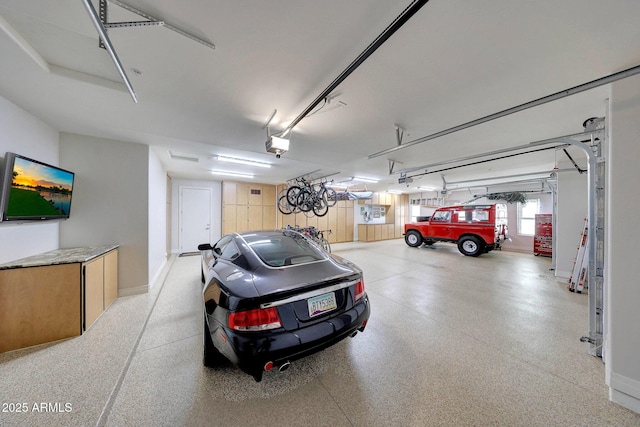 garage featuring a garage door opener