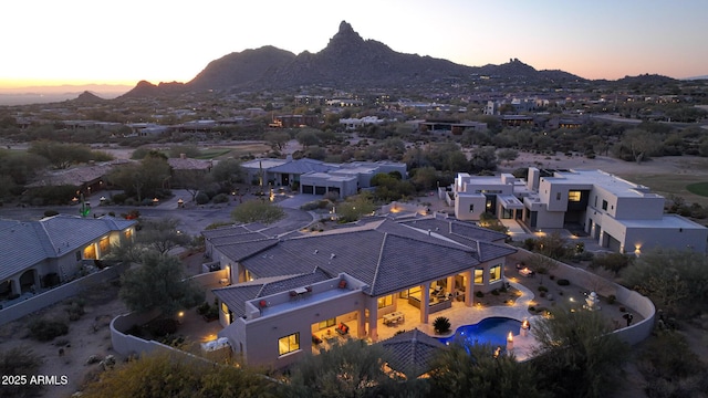 aerial view at dusk with a mountain view