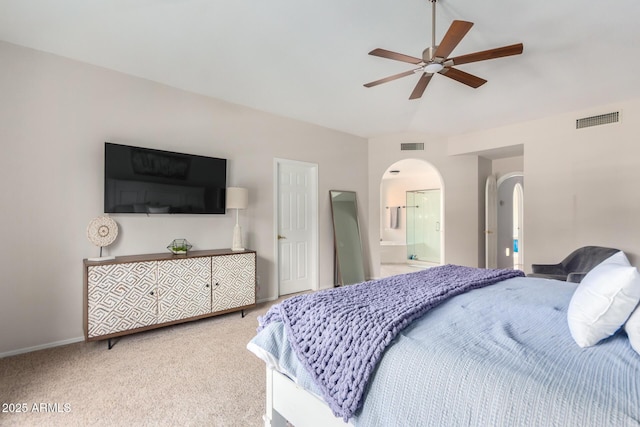 carpeted bedroom featuring ensuite bathroom and ceiling fan