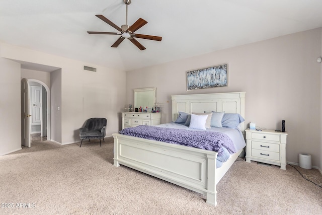 bedroom featuring ceiling fan and light carpet