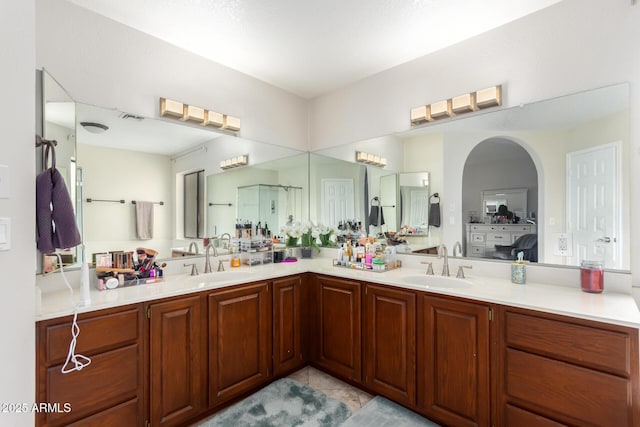 bathroom with tile patterned flooring and vanity