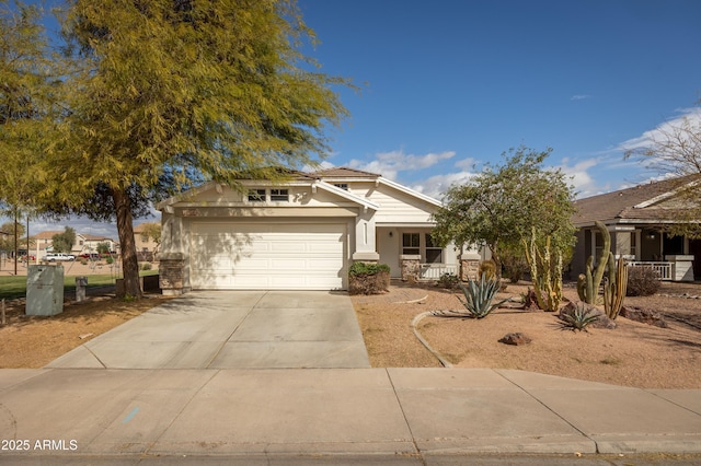 view of front facade with an attached garage, covered porch, and concrete driveway