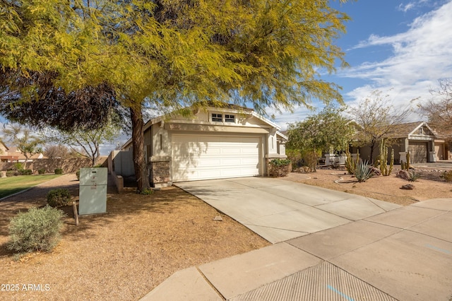 view of front of property featuring driveway and an attached garage