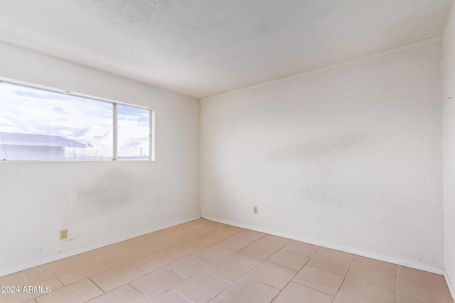 empty room with a textured ceiling