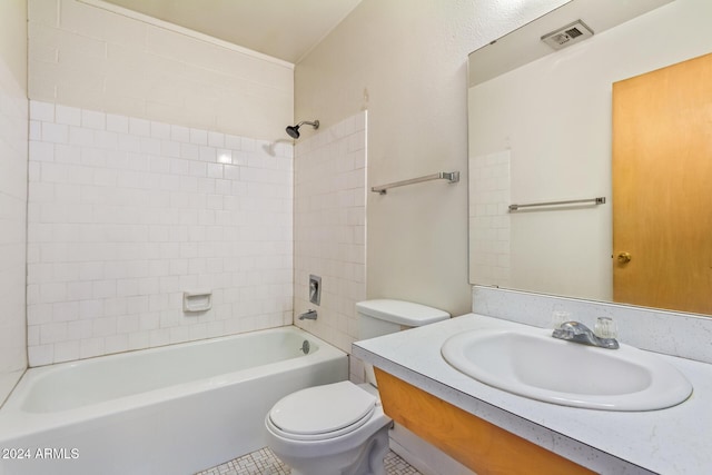 full bathroom with vanity, toilet, and tiled shower / bath