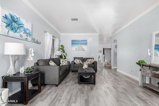 living room with hardwood / wood-style flooring and crown molding