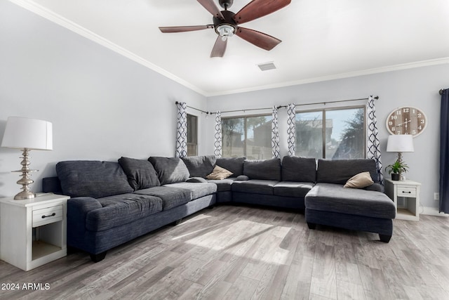 living room with light hardwood / wood-style flooring, ceiling fan, and crown molding